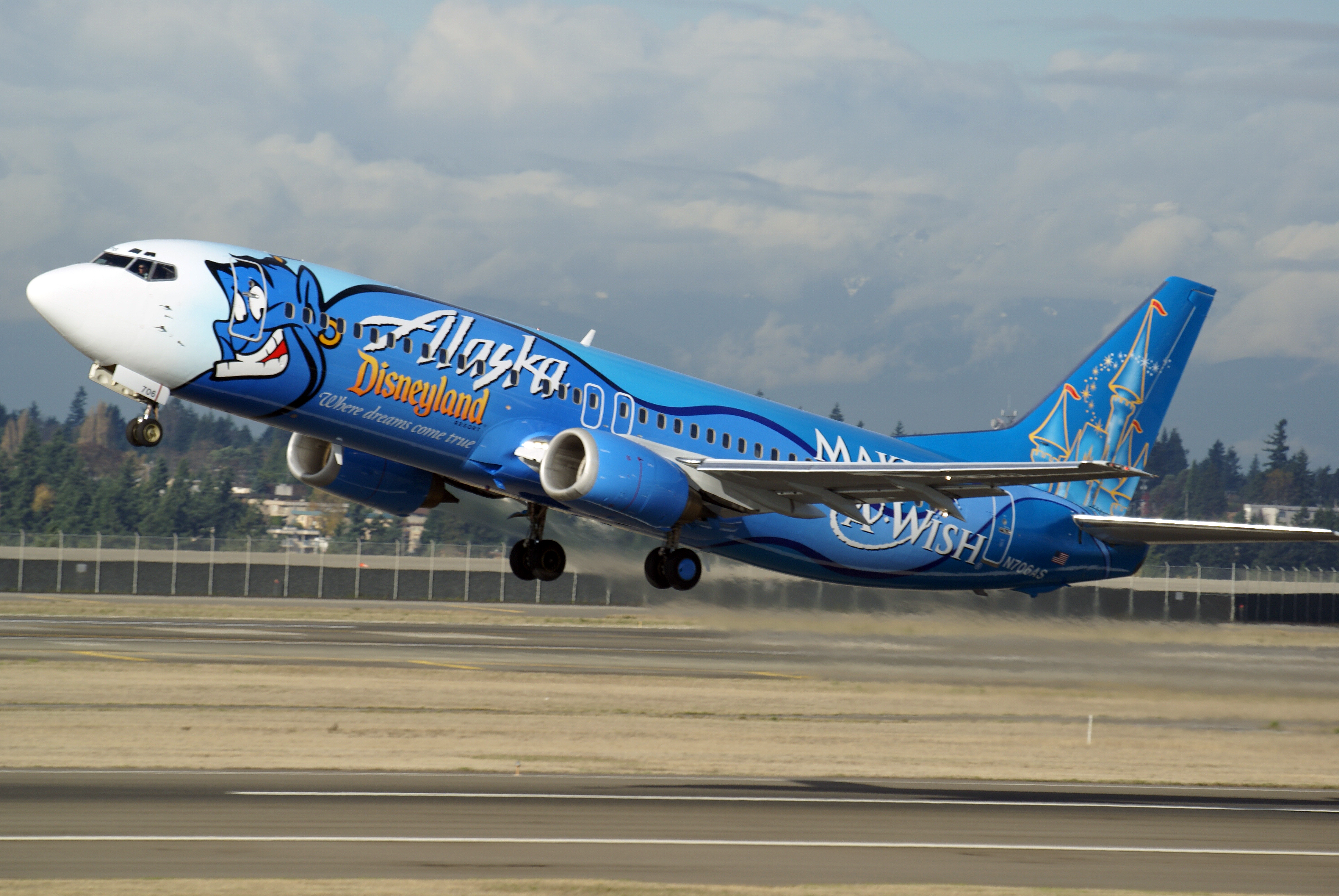 Alaska Airlines’ giant blue Genie dubbed the “Spirit of Make-a-Wish” plane flies throughout the carrier’s route network. First introduced in 2006, the Boeing 737-400 celebrates the long-term partnership between the Make-A-Wish Foundation, Disneyland Resorts and Alaska Airlines.